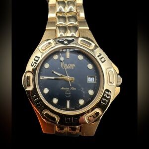 Bulova Gold-Tone Marine Star Watch.  Black Dial and Date. New old stock. Unused